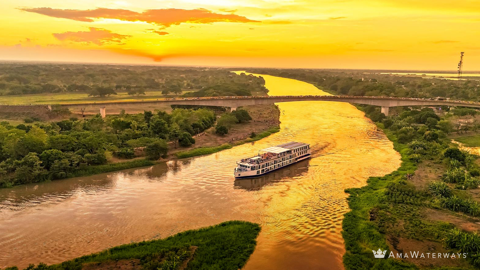 AmaWaterways ship cruising Colombia’s Magdalena River at sunset