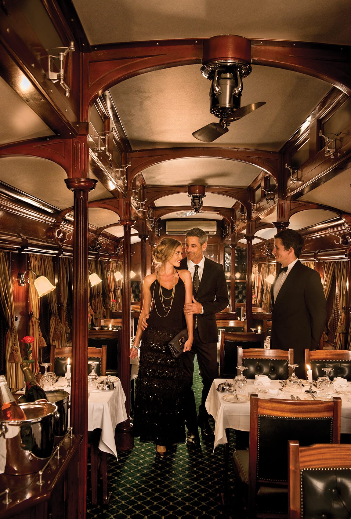 Formally dressed guests in the Rovos Rail dining car, South Africa